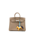 hermes-birkin-25-togo-etoupe-shw-stamp-d-with-an-extra-rodeo-pm-bag-charm