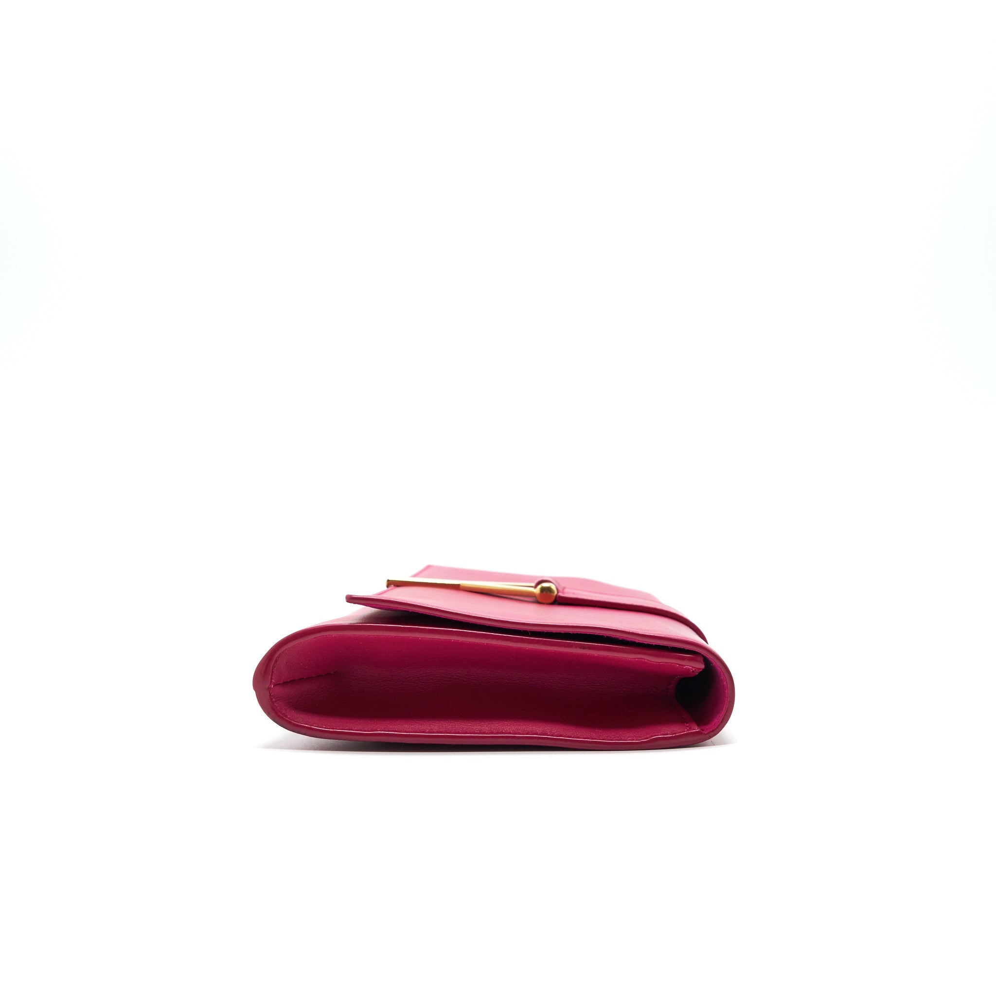 saint-laurent-ysl-clutch-in-fuchsia