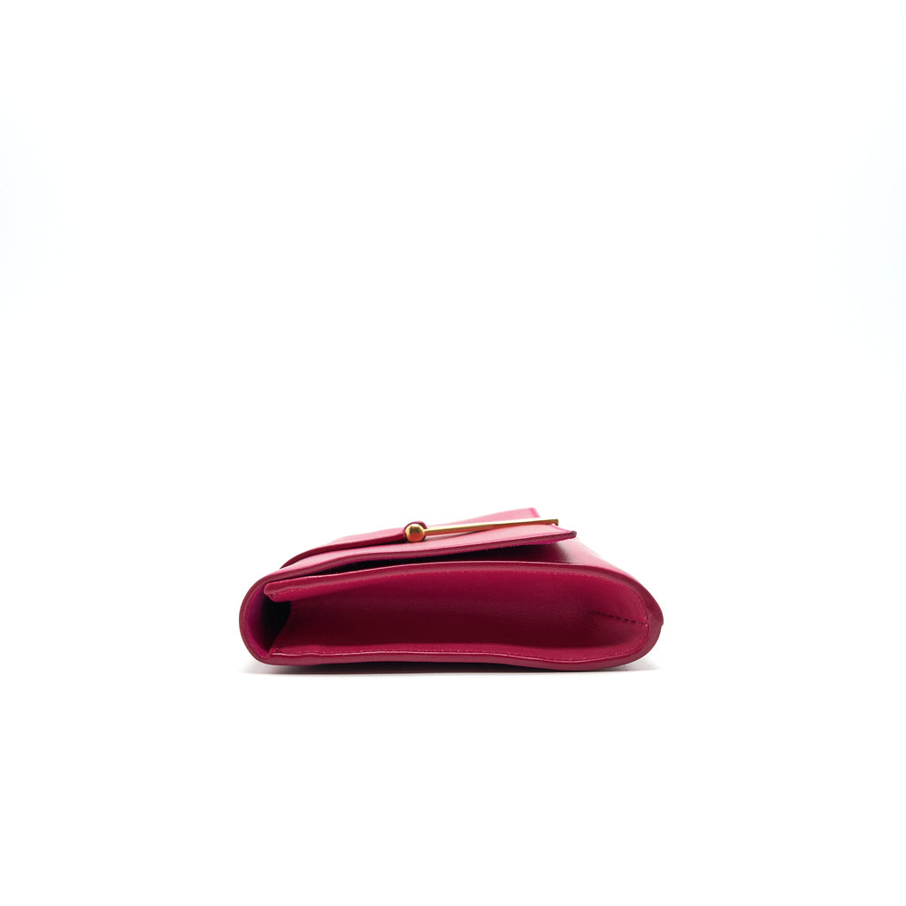 saint-laurent-ysl-clutch-in-fuchsia
