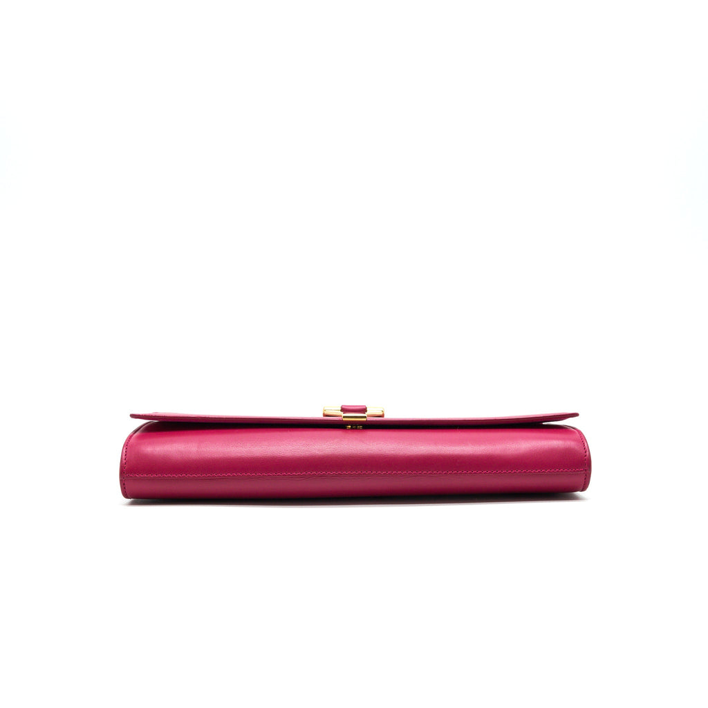 saint-laurent-ysl-clutch-in-fuchsia