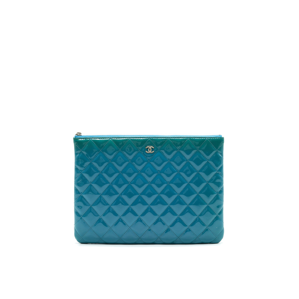 chanel-quilted-leather-clutch-bag-in-patent-blue