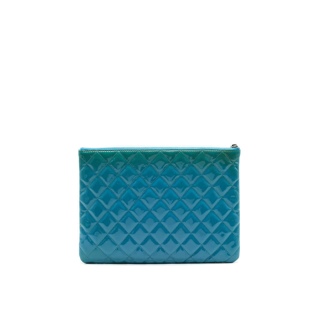 chanel-quilted-leather-clutch-bag-in-patent-blue
