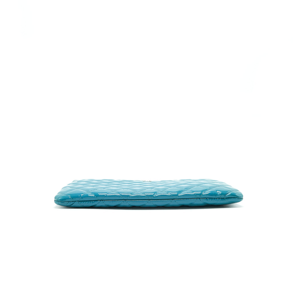 chanel-quilted-leather-clutch-bag-in-patent-blue