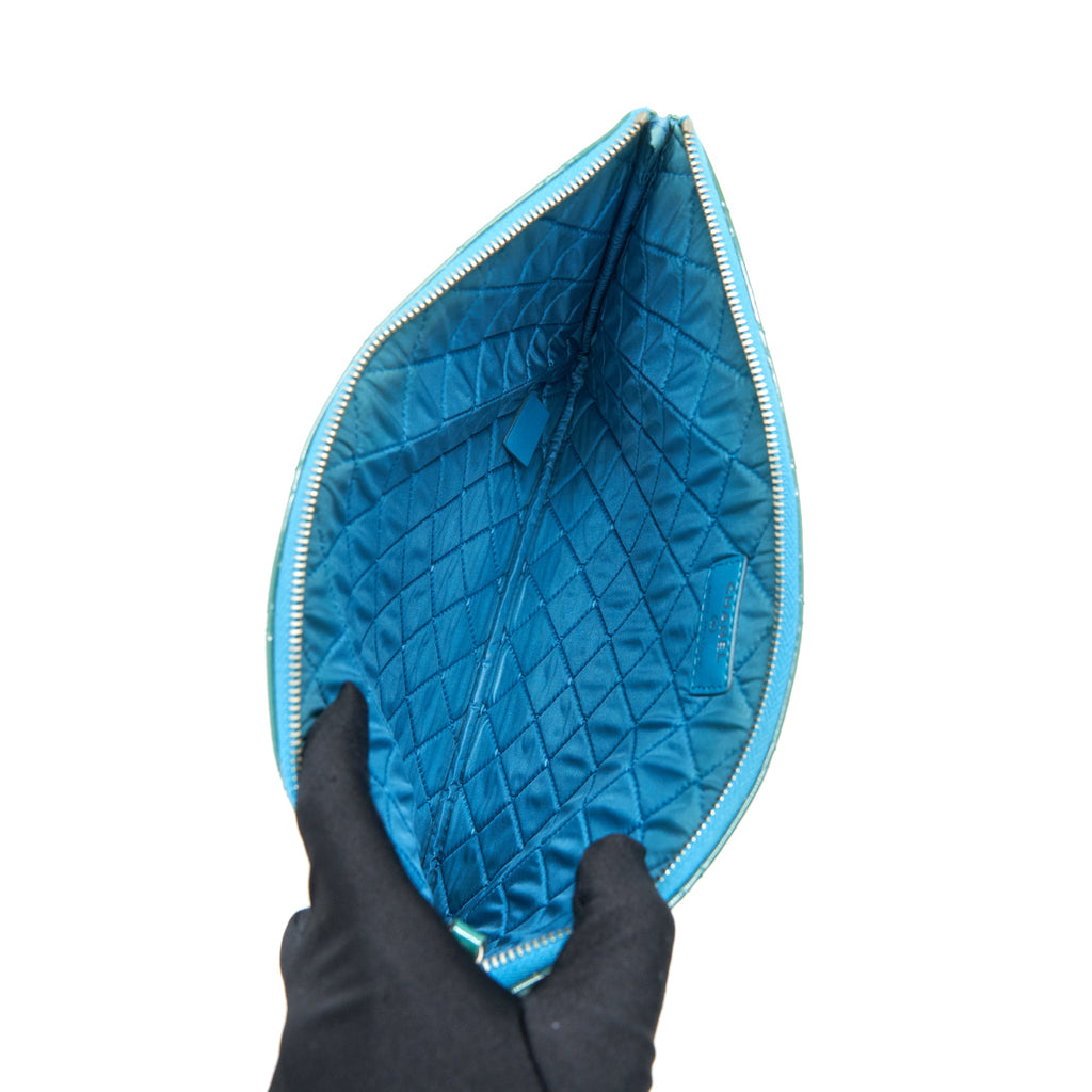 chanel-quilted-leather-clutch-bag-in-patent-blue
