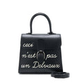 delvaux-l-humour-brilliant-ceci-nest-pas-un-delvaus-bag-black
