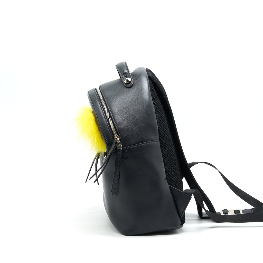 fendi-monster-backpack-in-black-with-yellow-fur