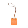 hermes-orange-bag-charm-feu-gold-stamp-y